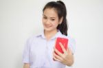 Portrait Of Thai High School Student Uniform Beautiful Girl Using Her Smart Phone Selfie Stock Photo