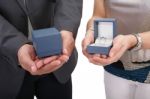 Couple Hands Holding Boxes With Rings. Valentines Day And Engage Stock Photo