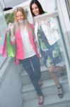 Two Young Friends On The Steps Of Parking In A Shopping Afternoo Stock Photo