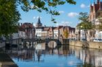 View Along A Canal In Bruges West Flanders In Belgium Stock Photo