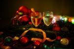 Two Glasses Of Champagne With A Christmas Decor In The Background Stock Photo