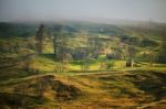 Foggy Spring Morning In Mountain Village. Fields And Hills Stock Photo