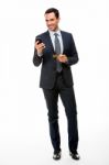 Businessman With Phone And Credit Card Stock Photo