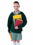 School Girl Standing With Notebooks Stock Photo