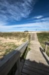 Wooden Walkway Across The Beach On The Uruguayan Eco-lake Garzon Stock Photo