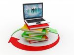 A Laptop With Books Stock Photo