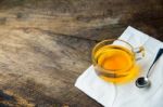 Glass Cup Of Tea And Spoons With Green Leaves Tea Stock Photo