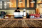 Selected Focus Empty Brown Wooden Table And Coffee Shop Or Resta Stock Photo