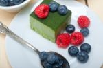 Green Tea Matcha Mousse Cake With Berries Stock Photo