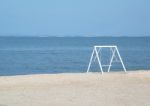 Swing On The Beach Stock Photo