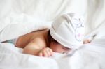 Face Down Lying Baby On Bed Stock Photo