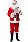 Father Christmas Using New Tablet Device Stock Photo