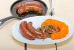 Beef Sausages Cooked On Iron Skillet Stock Photo