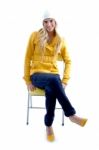 Smiling Woman Sitting On Chair Stock Photo