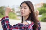 Asia Thai Teenager Women Scotch T-shirt Relax And Smile Stock Photo