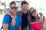 A Group Of Friends Talking In The Street After Class Stock Photo