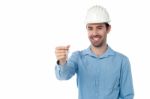 Smiling Engineer Holding Key Stock Photo