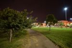 Night Public Park In The City With Houses Near Stock Photo