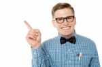 Smiling Nerd Pointing Away Stock Photo