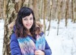 Portrait Of Young Beautiful Woman Walking In The Woods Stock Photo