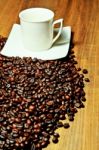 White Cup With Coffee Beans Stock Photo