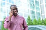 Casual Male Talking On Mobile Phone Stock Photo