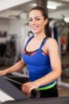 Beautiful Brunette On A Treadmill Stock Photo