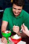 Young Guy Enjoying Tempting Dessert Stock Photo