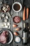 Ingredients For Boeuf Bourguignon On The Old Wooden Table Top View Stock Photo