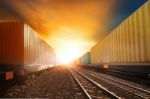 Industry Container Trainst Running On Railways Track Against Bea Stock Photo