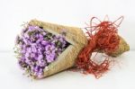 Violet Statice Flower Bouquet On White Cement Wall And White Table Stock Photo