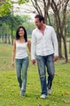 Young Couples Walk Hand In Hand Stock Photo