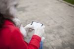 Mobile Phone In Hands With Glowes, Cold Weather Stock Photo