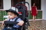 Mother And Son Standing At The House Stock Photo