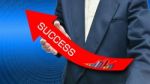 Businessman Holding Success Arrow Stock Photo