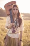 Hippie Woman Walking In Golden Field Stock Photo