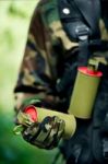 Soldier Carrying A Smoke Bomb Stock Photo