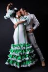 Young Flamenco Dancers In Beautiful Dress On Black Background Stock Photo