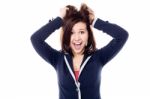 Young Girl Pulling Her Hair In Excitement Stock Photo