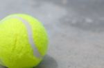 Tennis Ball On The Ground Stock Photo