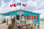 Tour Center At Wooden Pier Dock In Caye Caulker Belize Stock Photo