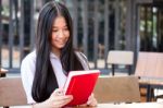 Asia Thai High School Student Uniform Beautiful Girl Read A Book Stock Photo