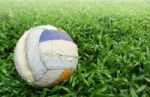 Old Soccer Ball On Green Grass Stock Photo