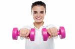 Image Of Young Girl Posing With Dumbbells Stock Photo