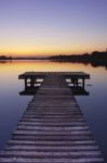 Lake Pier At Sunset Stock Photo