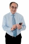 Old Corporate Man Using Cellphone Stock Photo