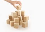 Single Hand Playing Wooden Box On Isolated Background Stock Photo