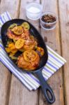 Delicious Baked Chicken Thighs With Lemon Slices, Onion And Zucchini Stock Photo