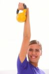 Happy Fitness Woman Lifting Kettlebell Stock Photo