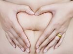 Heart Shape On Stomach Stock Photo